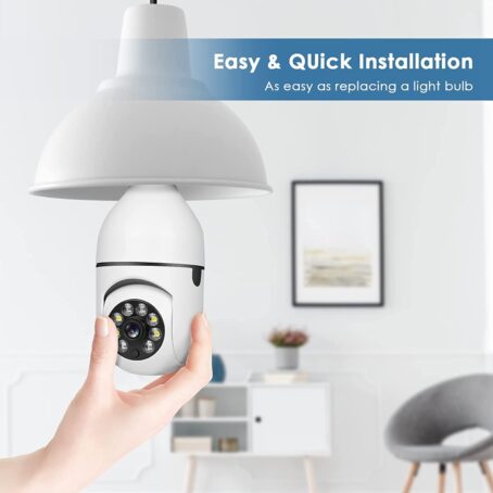 Person installing a wireless light bulb security camera in a lamp socket, showing easy and quick installation in a modern home interior