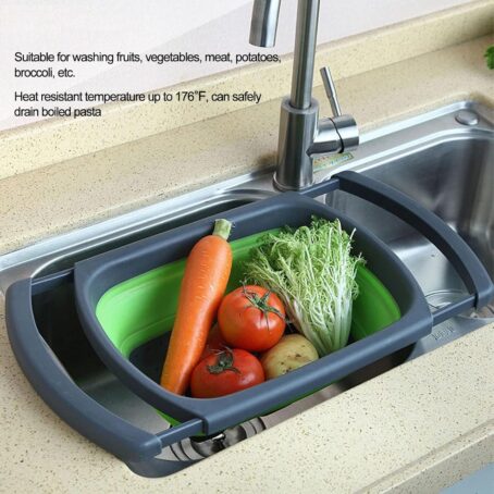 Green and gray foldable silicone basket placed over a sink, filled with vegetables; text describing its uses and heat resistance