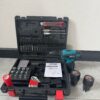 ADM cordless electric screwdriver and drill set with a carrying case, various drill bits, screwdriver bits, a red utility knife, user manual, flashlight, battery charger, and two 36VF batteries, displayed on a light floor.